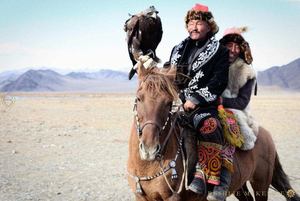 Mongolian eagle hunters on horseback