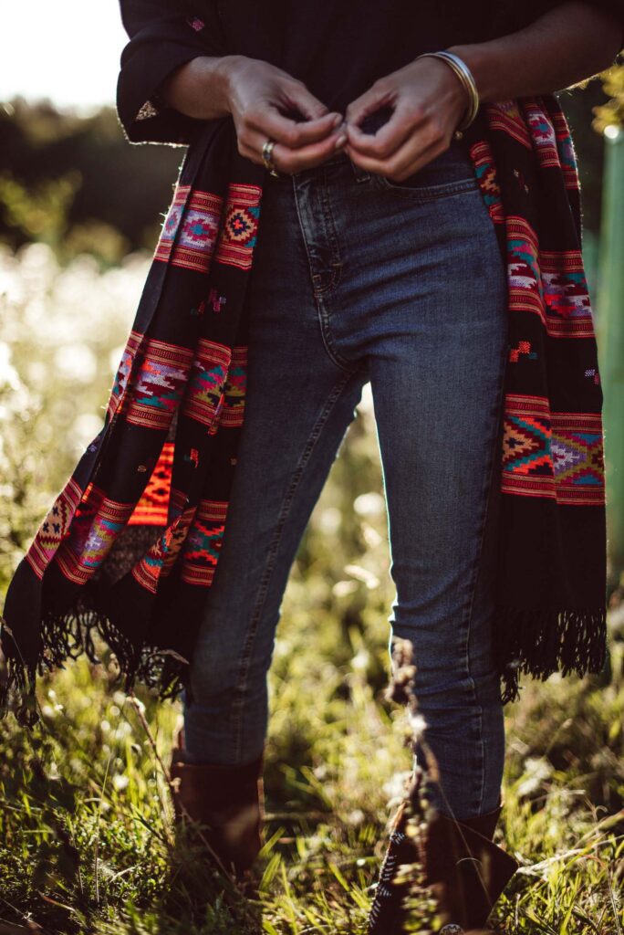 head turning scarf in black with orange aztec design