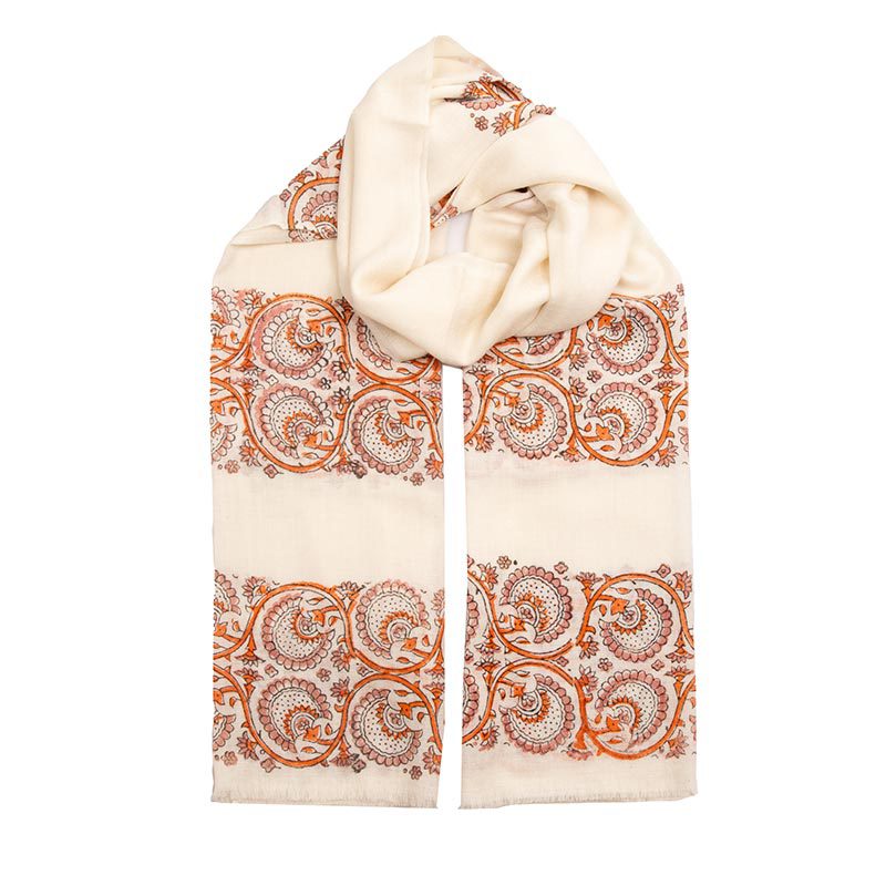 The beautiful Lotus Love cashmere scarf. Orange swirls on a light base, accentuated by light bands, showcase Jodhpur artisans' block print mastery.
