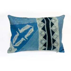 A handcrafted Kantha cushion with a blue fabric cover, featuring white arrow and geometric triangle embroidery patterns with black accents