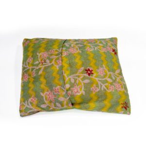 A handcrafted Kantha cushion with a green and yellow zigzag pattern fabric cover, featuring intricate pink and red floral embroidery with green vines