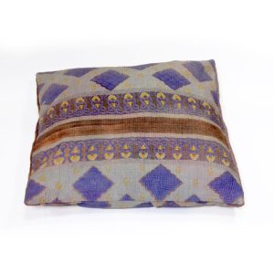 A handcrafted Kantha cushion with a light grey fabric cover, featuring indigo diamond patterns and a central brown band with intricate yellow and purple floral embroidery