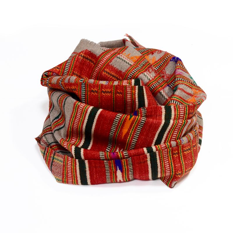 Hand-crafted Khadi Wool Shawl from villages outside Rajasthan, featuring red, grey, and multicolored stripes with plaid and checkered patterns, geometric tribal motifs, and a decorative border, made from sustainable wool and cotton for a warm, bohemian meditation or peace shawl.