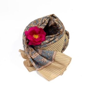 Hand block printed on organic cotton Pareo Beach Sarong with a beige base, intricate floral patterns, symmetrical geometric border, and striped edge, showcasing traditional handcrafted artistry for a stylish, eco-friendly beach accessory.