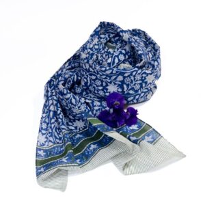 Hand block printed on organic cotton scarf with a soft beige base, intricate blue floral patterns, delicate leaf motifs, and a decorative geometric border, showcasing traditional craftsmanship for an elegant, eco-friendly accessory.
