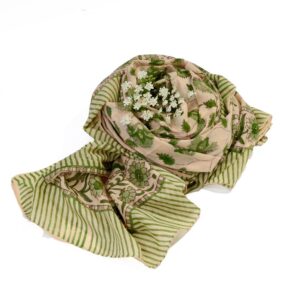 Hand block printed on organic cotton Pareo Beach Sarong with a light beige base, intricate green floral patterns, leafy motifs, and a green-beige striped border, showcasing traditional craftsmanship for a stylish, eco-friendly beach accessory.