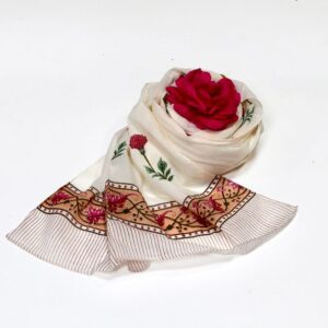 Hand block printed on organic cotton scarf with intricate orange and white floral patterns, delicate grey leaf motifs, and a decorative geometric border, showcasing traditional techniques and natural dyes for an elegant, eco-friendly accessory.