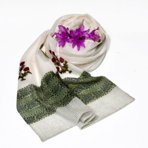 Hand block printed on organic cotton scarf with a soft lavender base, intricate white and pink floral patterns, subtle green leaf motifs, and a delicate geometric border, showcasing traditional techniques and natural dyes for an elegant, eco-friendly accessory.