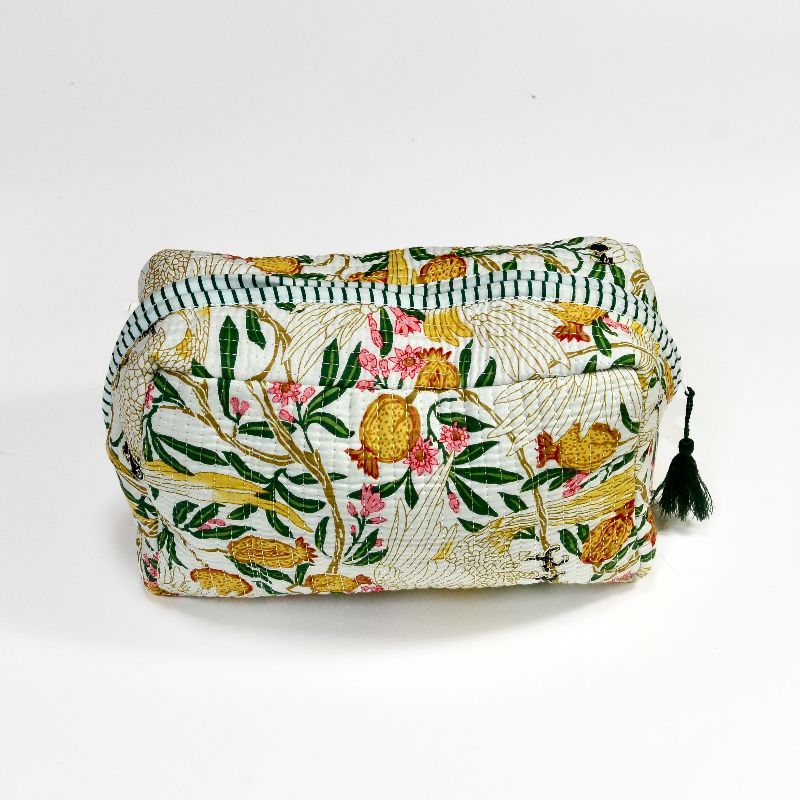This handcrafted cosmetics bag featuresĀ golden-yellow birds, orange and yellow pomegranates, pink blossoms, and lush green leaves, all meticulously stitched to create a rich, nature-inspired aesthetic.