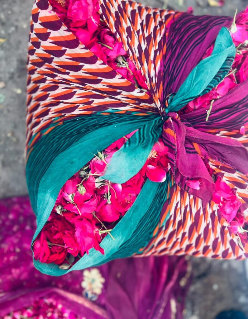 bundle of brightly coloured fabrics from India