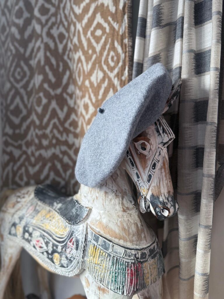 grey beret and ikat blanket