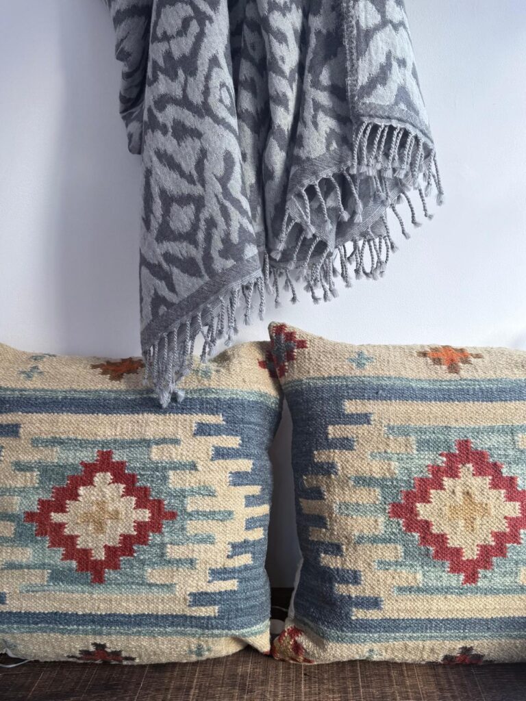 ikat blanket and aztec cushions