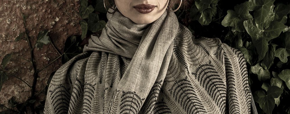 closeup of model in fern block printed cashmere shawl